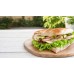 Fladenbrot belegt mit Putenbrust, Sause, Salat, Gurken